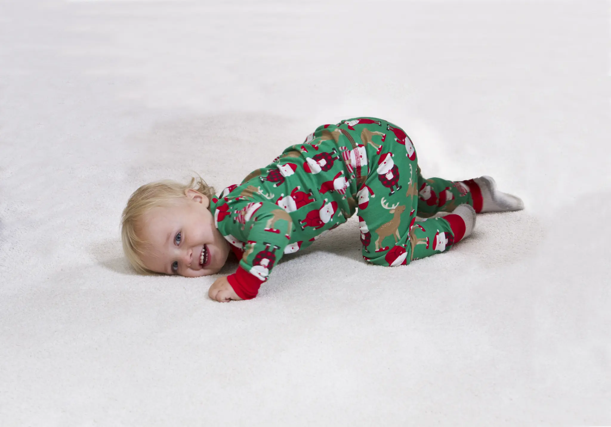 Baby playing safely on freshly cleaned carpet