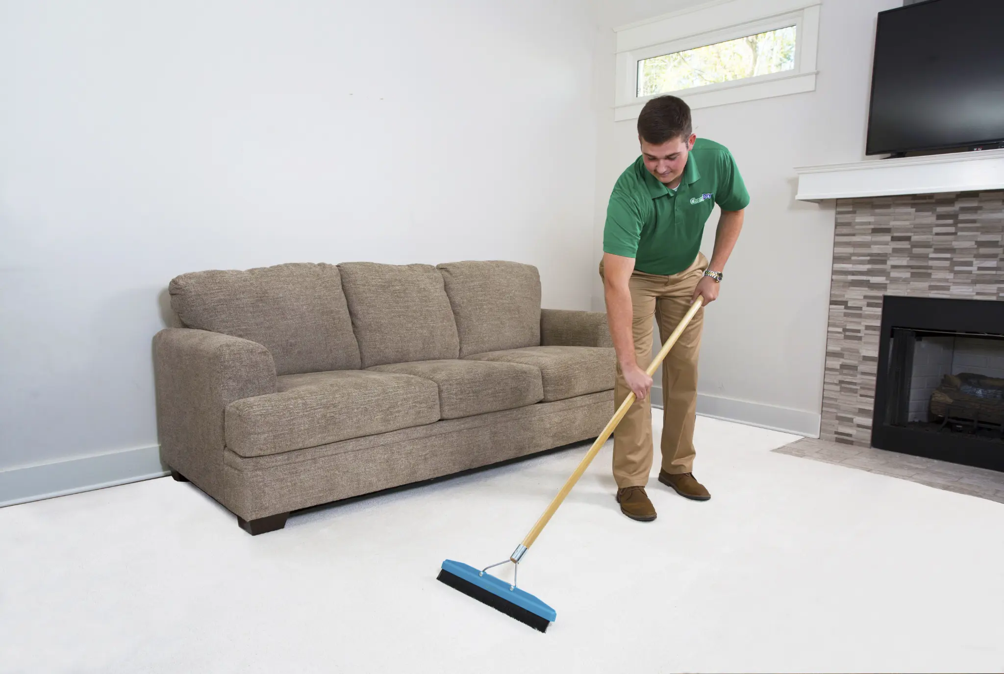 Chem-Dry technician grooming carpet