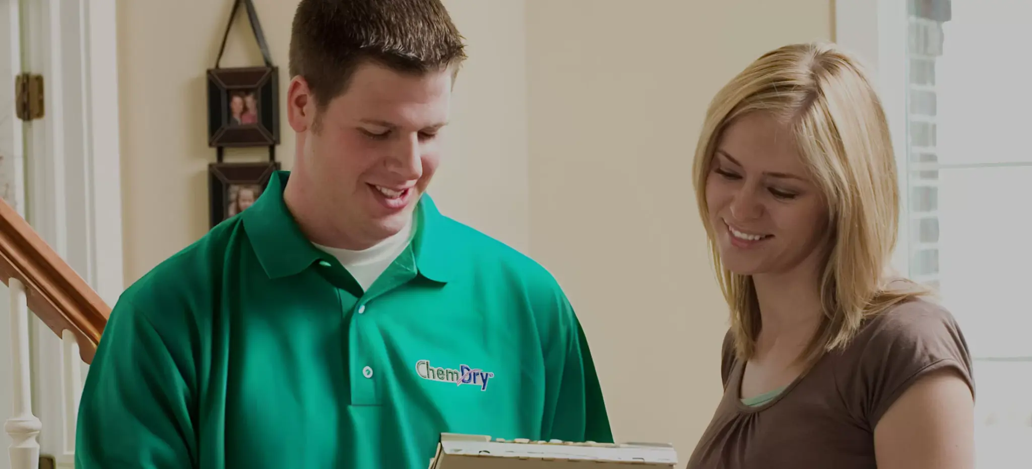 Chem-Dry technician reviewing job details with customer